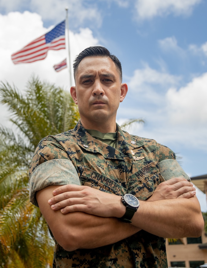 U.S. Marine Corps Lt. Col. Joshua Chambers, operational planner, Operations Division, G-3, U.S. Marine Corps Forces, Pacific, poses for a photo on Camp H.M. Smith, Hawaii, Apr. 1, 2025. Chambers recounts the story of how his great-grandfather, Col. Justice M. Chambers, received the Medal of Honor for his actions during the Battle of Iwo Jima. The Battle of Iwo Jima, fought from February 19 to March 26, 1945, was one of the deadliest campaigns undertaken by the United States Marine Corps during World War II. Joshua Chambers is a native of Austin, Texas. (U.S. Marine Corps photo by Lance Cpl. Jose Villasenor)