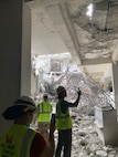 Members of a U.S. military Joint Engineer Response team assess damage and structural integrity after a 7.7 magnitude earthquake affected Thailand and its neighbor countries on March 28, 2025.