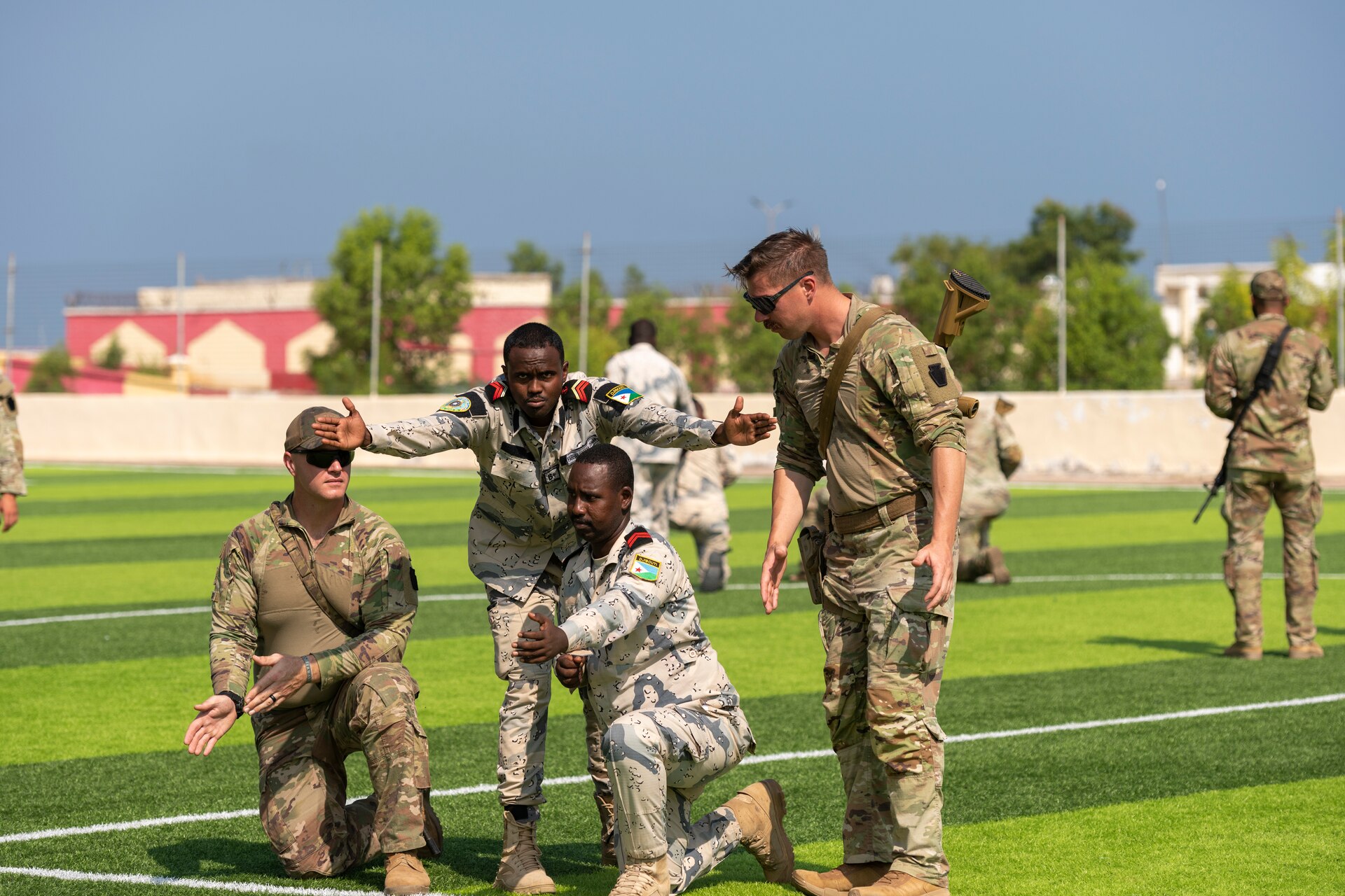 U.S. Army soldiers, assigned to Task Force Associator, work with members from the Djiboutian Coast Guard to preform squad movement and battle drills during Bull Shark 25-1 at Garde-Côtes Djiboutienne GCD, Djibouti, Nov. 4, 2024.