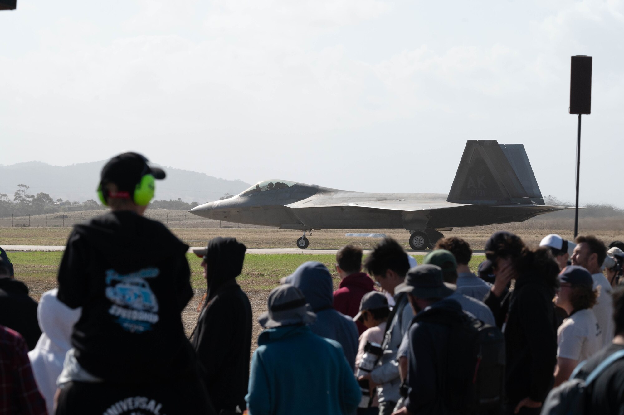 Attendees at Avalon Australian International Airshow watch as the F-22 Raptor taxis to the flightline at Avalon Airport, Australia, March 30, 2025.