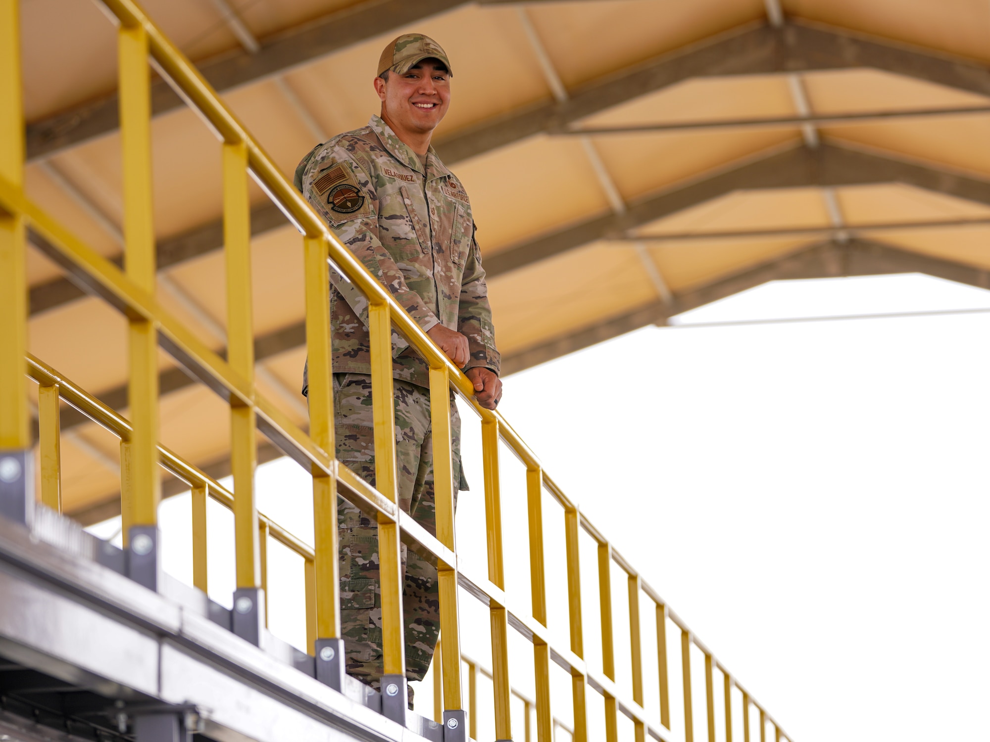 U.S. Air Force Tech. Sgt. Daniel Velasquez, 378th Expeditionary Security Forces Squadron physical security noncommissioned officer in charge, poses for a photo on the catwalk he led the effort to establish in the U.S. Central Command area of responsibility, April 1, 2025.