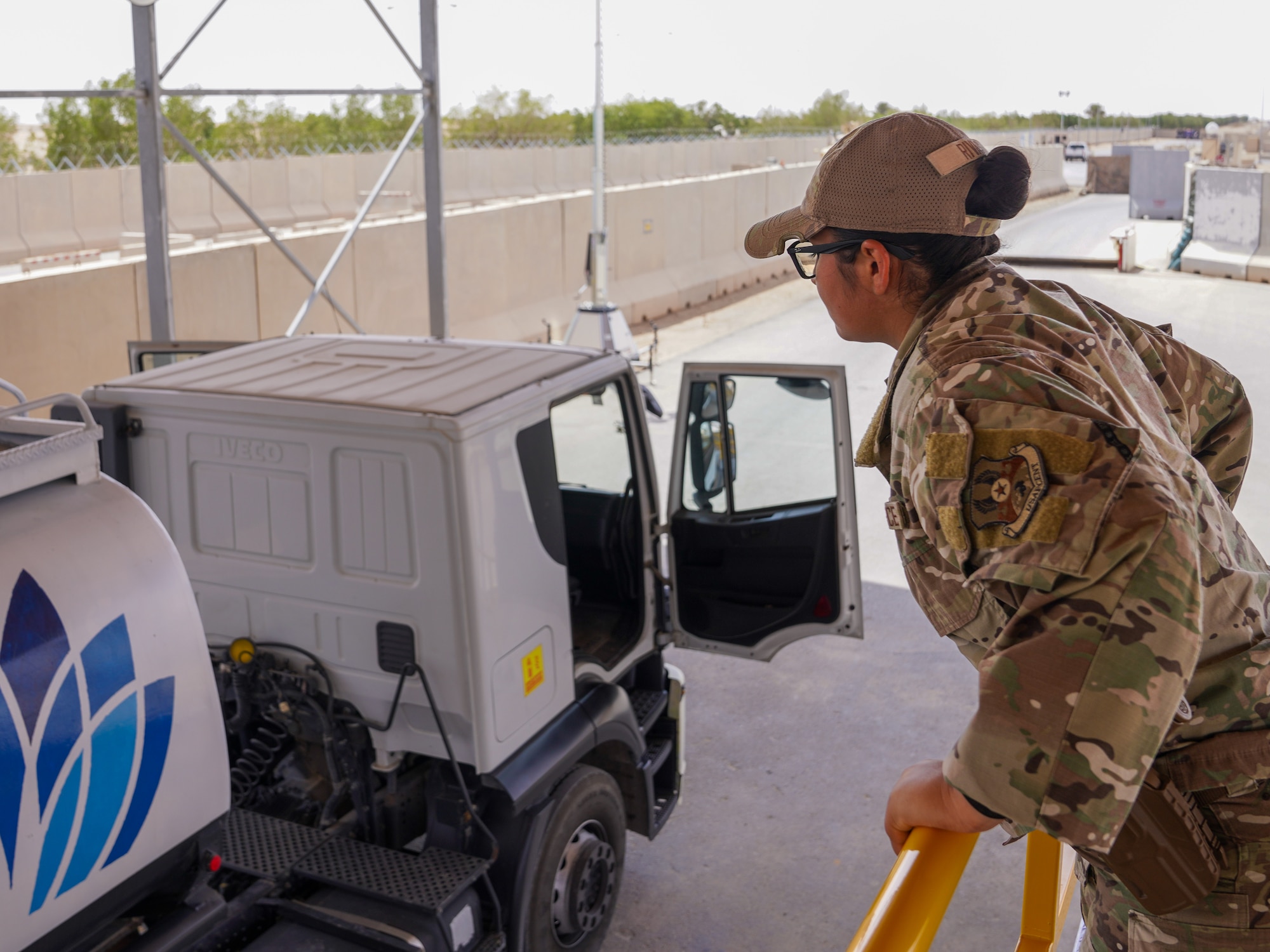 U.S. Air Force Airman 1st Class Jazmine Rivas, 378th Expeditionary Security Forces Squadron visitor control center member, inspects a commercial vehicle from a newly installed catwalk in the U.S. Central Command area of responsibility, March 31, 2025.