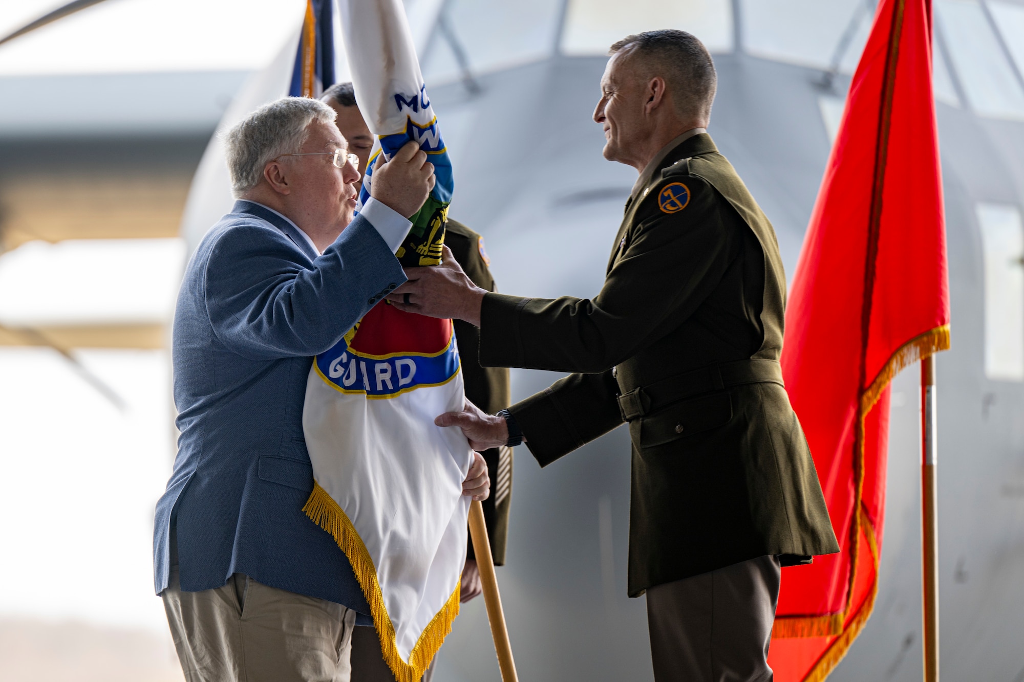 ceremony in an airport hanger