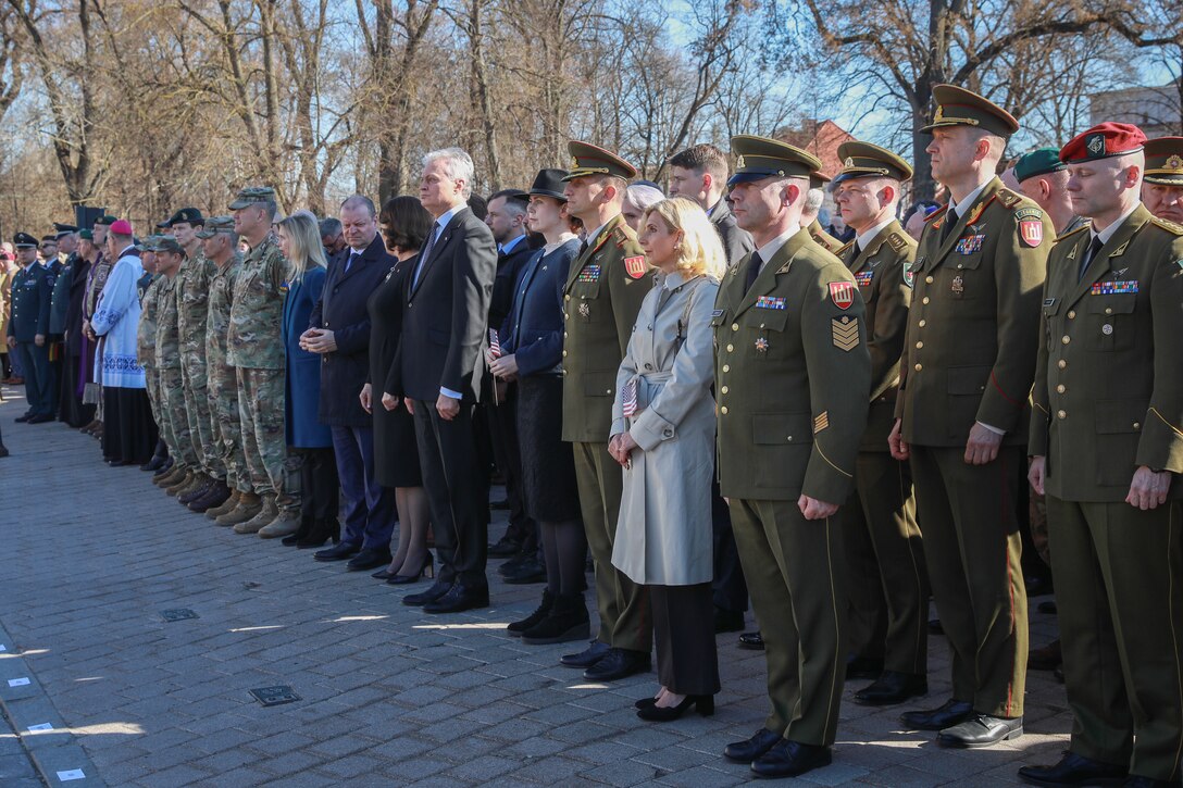 Lithuanian leaders and distinguished visitors gather to pay their respects to the fallen soldiers