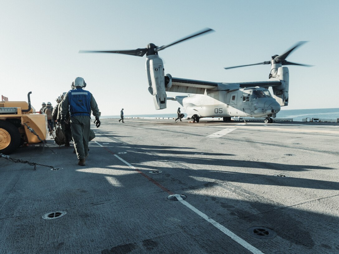 U.S. Marines with the 22nd Marine Expeditionary Unit and Marine Medium Tiltrotor Squadron 263 (Reinforced), 22nd MEU, prepare to load an MV-22B Osprey during flight line operations aboard the Wasp-class amphibious assault ship USS Iwo Jima (LHD 7), while underway in the Atlantic Ocean, March 27, 2025. Elements of the 22nd MEU conducted preliminary operations aboard the USS Iwo Jima to prepare for subsequent, larger-scale exercises with the Iwo Jima Amphibious Ready Group (IWO ARG) and 22nd MEU, enhancing the combined force's interoperability and warfighting effectiveness. (U.S. Marine Corps photo by Sgt. Tanner Bernat)