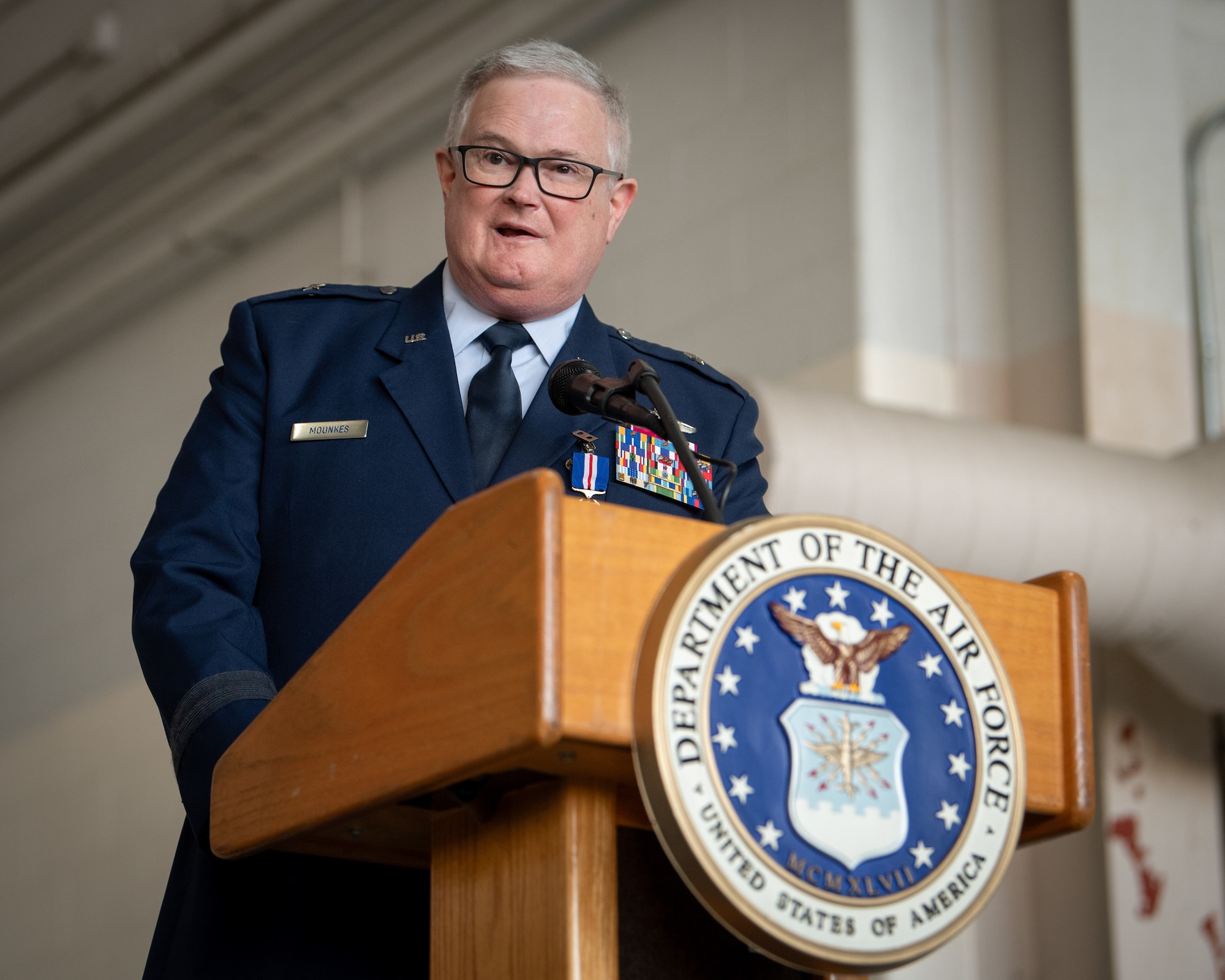 Brig. Gen. David Mounkes, Kentucky’s outgoing assistant adjutant general for Air, speaks during a change-of-command ceremony at the Kentucky Air National Guard Base in Louisville, Ky., March 14, 2025. Brig. Gen. Bruce Bancroft is replacing Mounkes, who is retiring from military service after a 35-year career in the active-duty Air Force and Air National Guard.  (U.S. Air National Guard photo by Master Sgt. Joshua Horton)