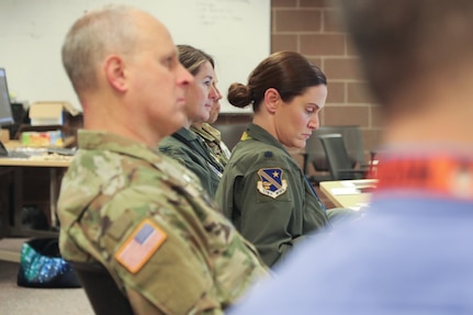 Soldiers, Airmen, and civilians of the Alaska National Guard participate in a mission planning brief during exercise Vigilant Guard 2025 at Joint Base Elmendorf-Richardson, Alaska, March 6, 2025.