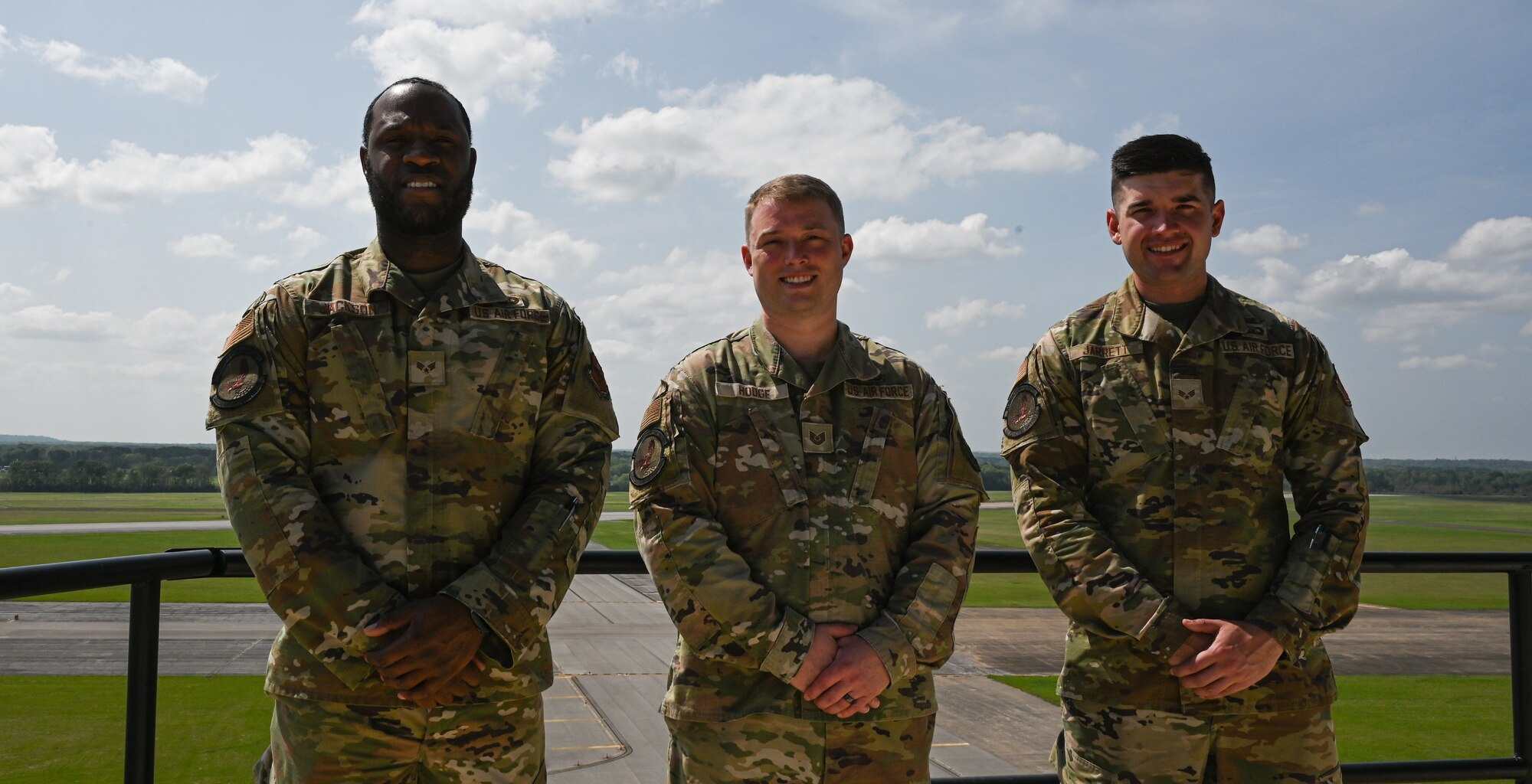 From left to right, U.S. Air Force Staff Sgt. Daiquan Jackson, Tech. Sgt. Brandon Hodge, and Senior Airman Logan Jarrett, 42nd Operations Support Squadron air traffic controllers, pose for a photograph at Maxwell Air Force Base, Alabama, April 1, 2025.