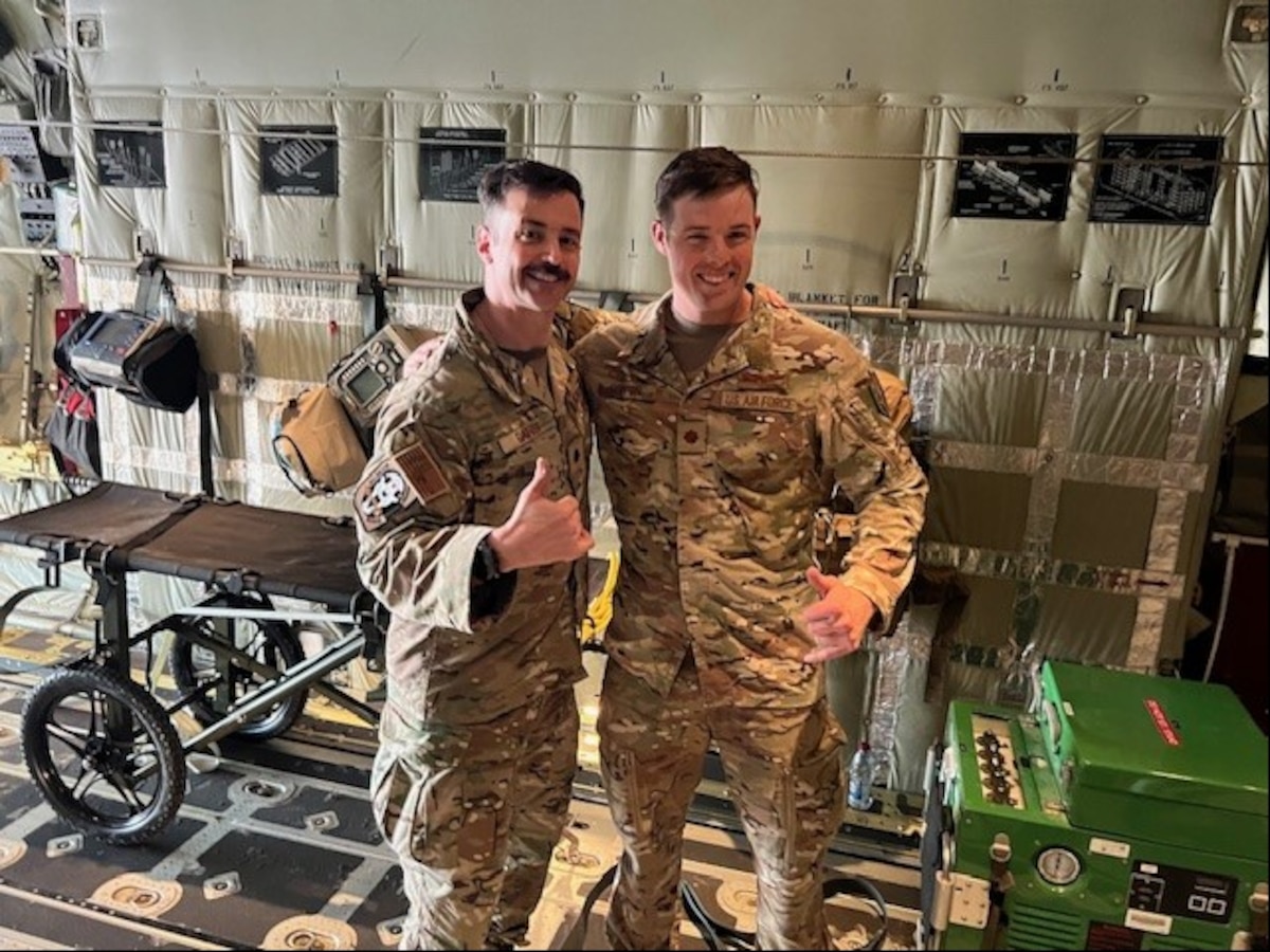 Image of two Airmen posing for a photo.