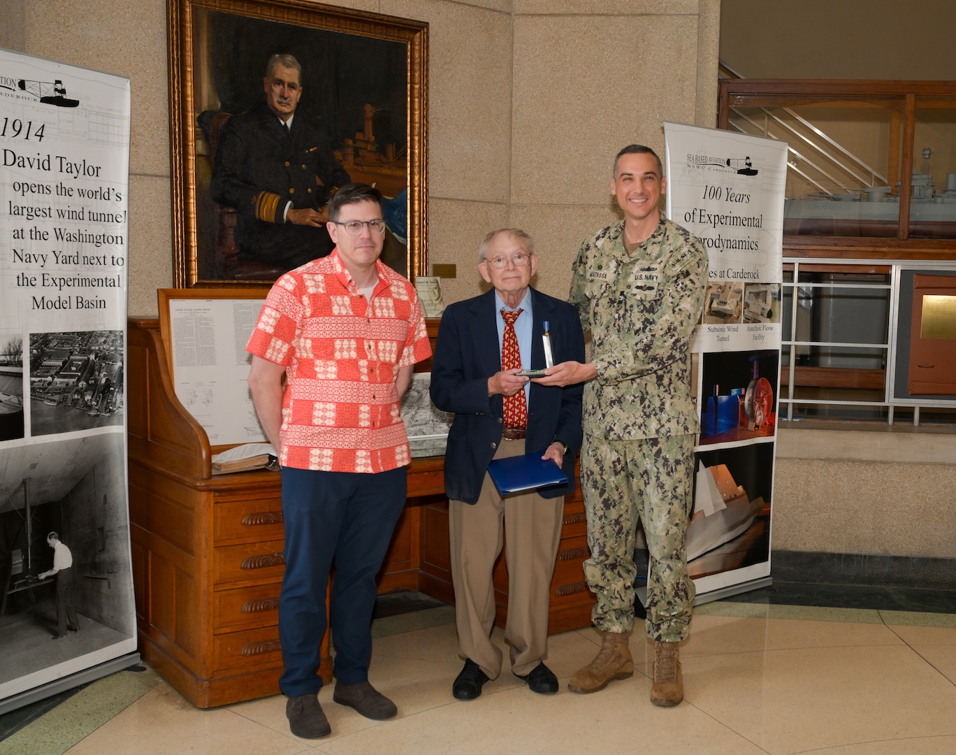 From left, Dr. David Drazen, Dana Wegner and Capt. Christopher Matassa following Wegner’s retirement ceremony at Naval Surface Warfare Center, Carderock Division, March 21, 2025. Wegner, curator of ship models, retired after 50 years of federal service and received the Department of the Navy Civilian Service Achievement Medal.