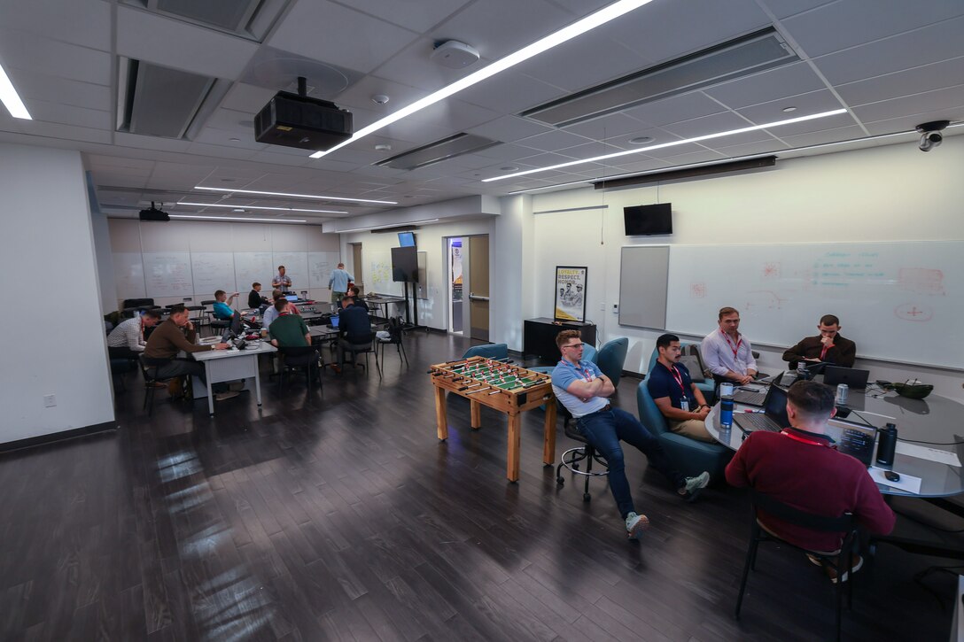 U.S. Marines assigned to the Marine Innovation Unit (MIU) work on the development of software applications at the Marine Corps Software Factory (MCSWF) in Austin, Texas, 17 - 29 March, 2025. MIU Marines are assisting MCSWF in the development and production of software solutions that address critical needs for the Marine Corps. MIU is a Selected Marine Corps Reserve unit headquartered in Newburgh, N.Y. that accelerates the development and adoption of advanced capabilities across the Marine Corps. (U.S. Marine Corps photo by Cpl. Orion Stpierre)