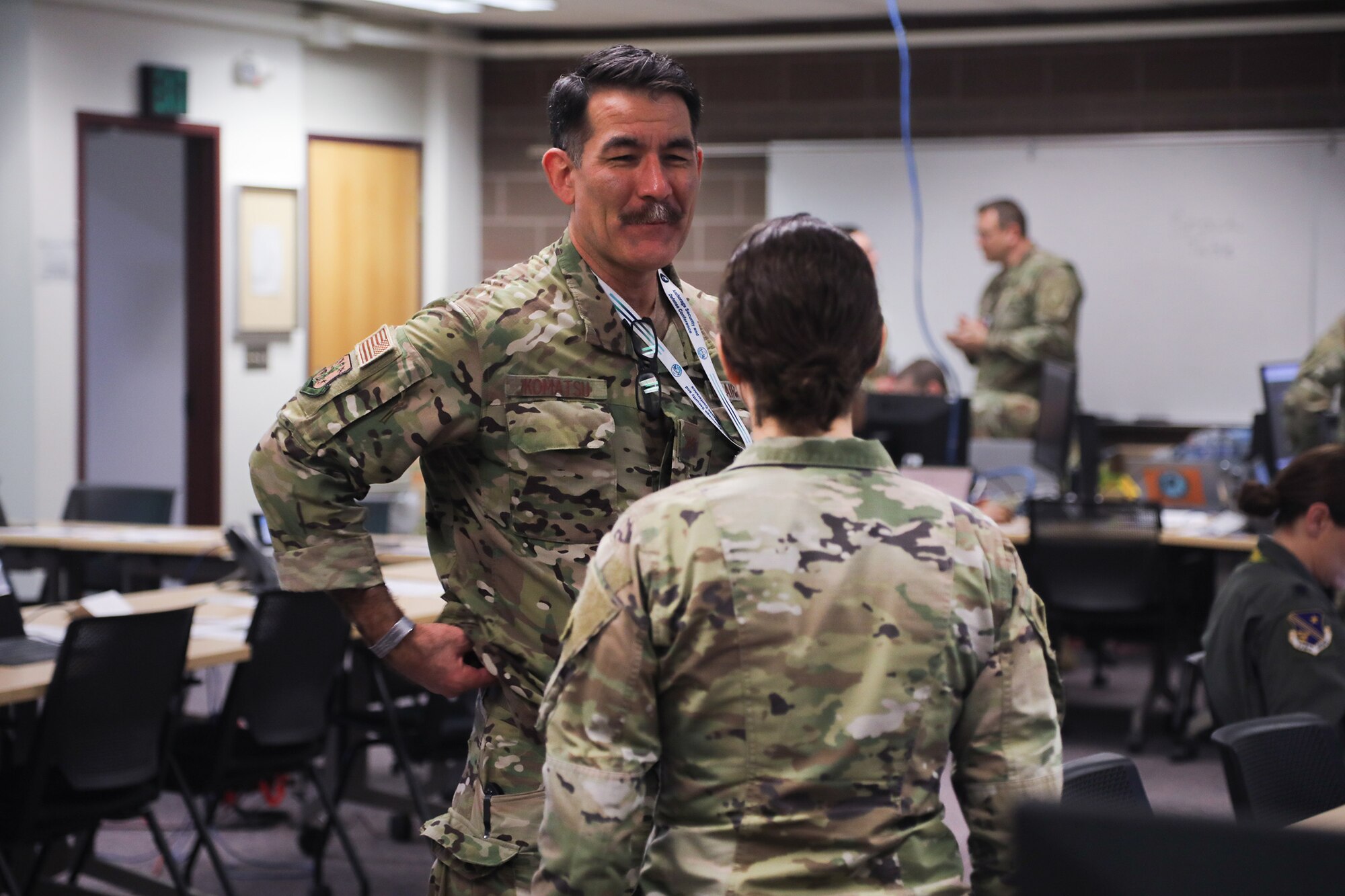 Col. Matthew Komatsu, director of Plans and Strategy for the Joint Staff, Alaska National Guard, discusses the role of Women, Peace, and Security during mission planning with Maj. Chelsea Aspelund, State Partnership Program director, Alaska National Guard, at Joint Base Elmendorf-Richardson, Alaska, March 6, 2025.