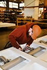 Norfolk Naval Shipyard’s Pipefitter Shop (Shop 56) Helper-to-Worker Pipefitter Benjamin Roach has been at the shipyard for almost two years. He is currently enrolled in the Helper-to-Worker Program, which is a three-year program to learn a specific trade. Before joining NNSY, Roach served in the U.S. Marine Corps for four years. “My primary job in the Marines was finances,” said Roach. “I knew this wasn’t for me, so after my enlistment was over, I joined the Helper-to-Worker Program to learn a trade and to work with my hands and I have no regrets in doing so.”