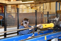Norfolk Naval Shipyard’s Pipefitter Shop (Shop 56) Pipefitter Tammy Davenport worked in a law office before joining the apprentice program six years ago. “I know that seems like a drastic change in careers, but when you’re raised with four brothers and helped your father in the garage, I knew I wanted a job that required hands-on and not sitting at a desk all day. Here I am, still loving every minute of it.”
