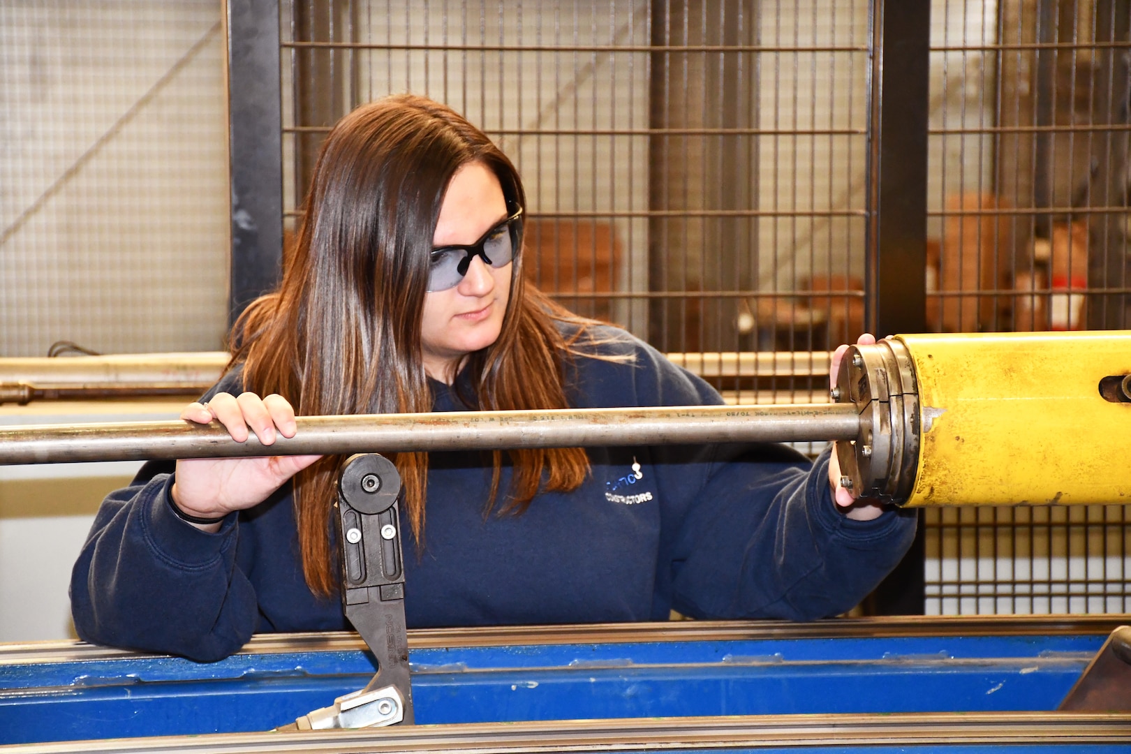 Norfolk Naval Shipyard’s Pipefitter Shop (Shop 56) Pipefitter Tammy Davenport worked in a law office before joining the apprentice program six years ago. “I know that seems like a drastic change in careers, but when you’re raised with four brothers and helped your father in the garage, I knew I wanted a job that required hands-on and not sitting at a desk all day. Here I am, still loving every minute of it.”