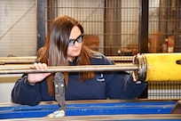 Norfolk Naval Shipyard’s Pipefitter Shop (Shop 56) Pipefitter Tammy Davenport worked in a law office before joining the apprentice program six years ago. “I know that seems like a drastic change in careers, but when you’re raised with four brothers and helped your father in the garage, I knew I wanted a job that required hands-on and not sitting at a desk all day. Here I am, still loving every minute of it.”