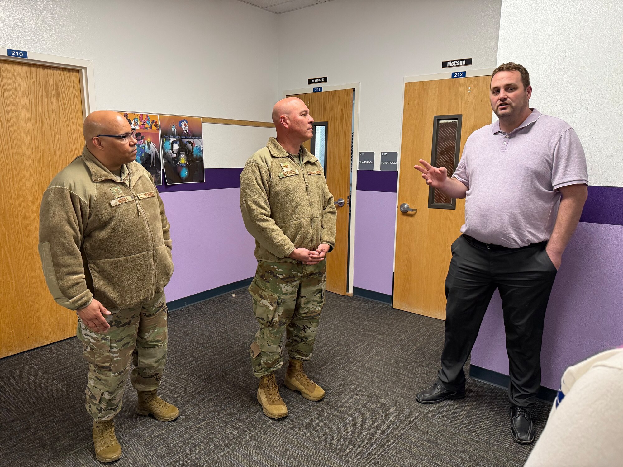 Michele Matte, District 22’s Ellicott Elementary School principal, and U.S. Air Force Col. David Berrios, Space Base Delta 1 deputy commander, visit the library during a tour of the school in Ellicott, Colorado, March 25, 2025.
