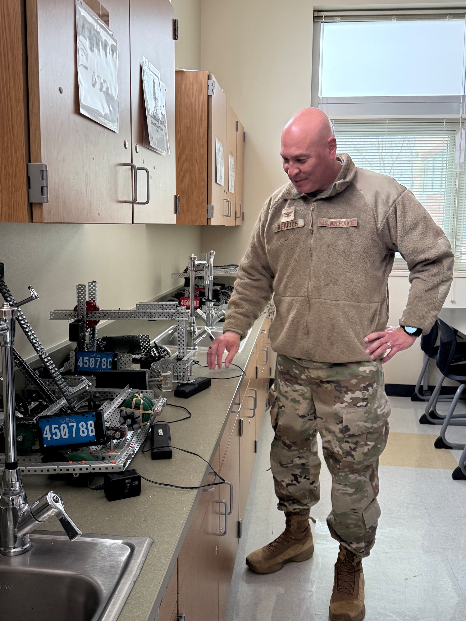 U.S. Air Force Col. David Berrios, Space Base Delta 1 deputy commander, views the robotics lab while on a tour of Ellicott Middle School in Ellicott, Colorado, March 31, 2025.