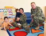 Three-year-old Philip Scott, one-year-old James Scott, NNSY Nuclear Regional Maintenance Department (NRMD) Electrician’s Mate (Nuclear) Anh Scott and NNSY’s Fleet Maintenance Submarine (FMB) Rubber and Plastic Shop (Shop 57B) Electrician’s Mate (Nuclear) First Class Michael Scott have been a military family since the birth of Philip Scott.