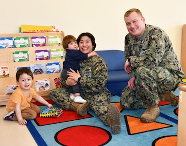 Three-year-old Philip Scott, one-year-old James Scott, NNSY Nuclear Regional Maintenance Department (NRMD) Electrician’s Mate (Nuclear) Anh Scott and NNSY’s Fleet Maintenance Submarine (FMB) Rubber and Plastic Shop (Shop 57B) Electrician’s Mate (Nuclear) First Class Michael Scott have been a military family since the birth of Philip Scott.