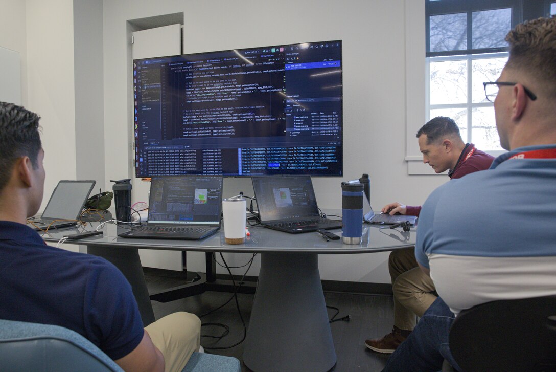 U.S. Marines assigned to the Marine Innovation Unit (MIU) write code at the Marine Corps Software Factory (MCSWF) in Austin, Texas, 17 - 29 March, 2025. MIU Marines are assisting MCSWF in the development and production of software solutions that address critical needs for the Marine Corps. MIU is a Selected Marine Corps Reserve unit headquartered in Newburgh, N.Y. that accelerates the development and adoption of advanced capabilities across the Marine Corps. (U.S. Marine Corps photo by Cpl. Orion Stpierre)