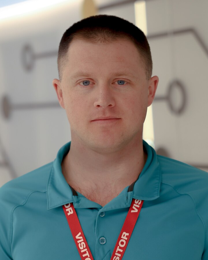 U.S. Marine Corps Staff Sgt. William F. Perry, a cyberspace technologies analyst with Marine Innovation Unit (MIU), Marine Forces Reserve, poses for a photo at the Marine Corps Software Factory (MCSWF), 21 March, 2025. Perry utilizes his civilian experience in the field of software engineering to help detect, analyze and solve coding issues for MIU and MCSW. Perry is a Albany, New York native. (U.S. Marine Corps photo by Cpl. Orion Stpierre)