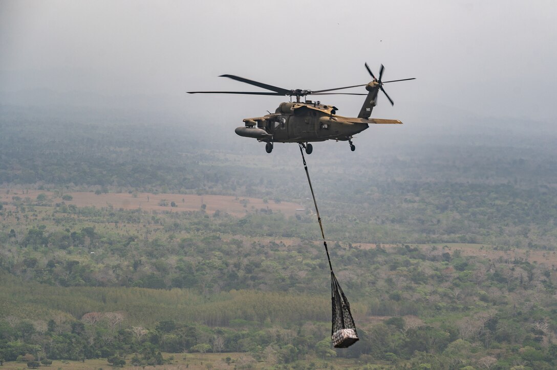 A Joint Task Force-Bravo HH-60 Blackhawk carries construction material during PANAMAX-Alpha Phase 0 in Panama, March 29, 2025.