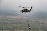 A Joint Task Force-Bravo HH-60 Blackhawk carries construction material during PANAMAX-Alpha Phase 0 in Panama, March 29, 2025.