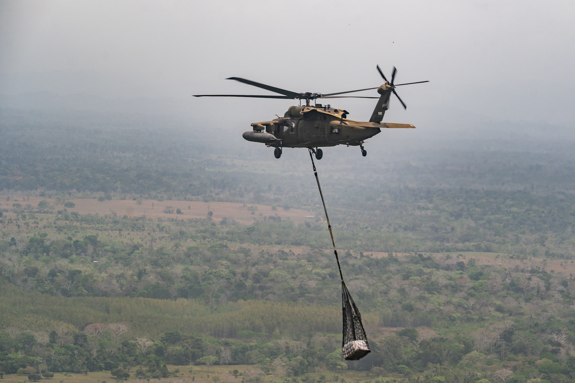 A Joint Task Force-Bravo HH-60 Blackhawk carries construction material during PANAMAX-Alpha Phase 0 in Panama, March 29, 2025.