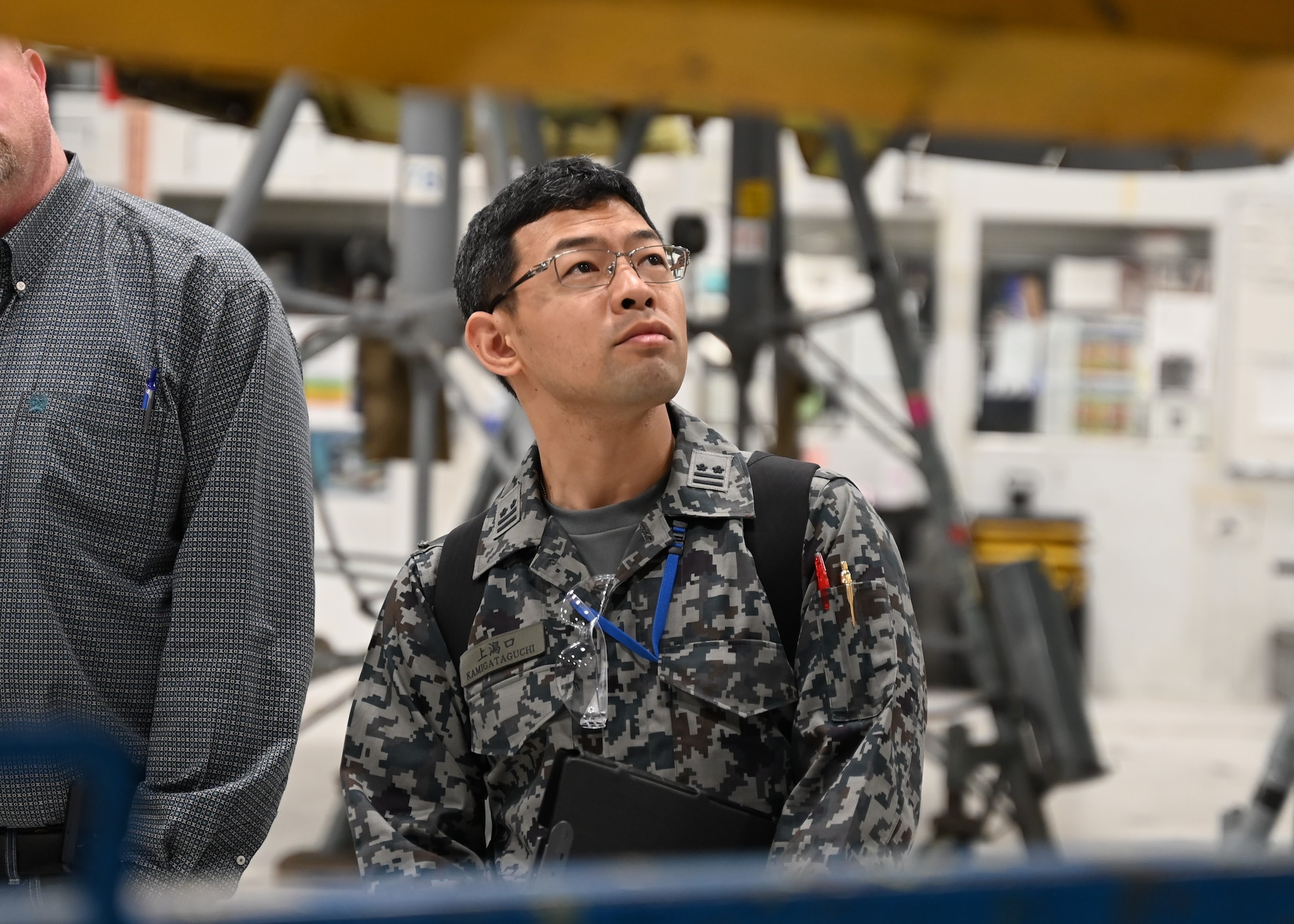 Man inside facility observes surroundings