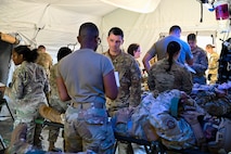 U.S. Air Force Airmen stage a medical scene.
