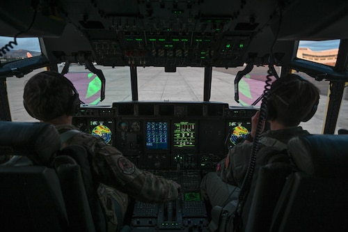 From left, 1st Lt. Allison McDonald, 41st Airlift Squadron pilot, and Maj. Laura Dempster, 327th AS pilot, prepare for takeoff in a C-130J Super Hercules aircraft during the Joint Pacific Multinational Readiness Center (JPMRC) 24-01 training exercise at Wheeler Army Airfield, Hawaii, Oct. 28, 2023. The 913th Airlift Group, the Air Force Reserve Command’s presence at Little Rock AFB, augments the total force effort with operational C-130 mission support, seamlessly integrating with active-duty and Guard components to enhance mission readiness.