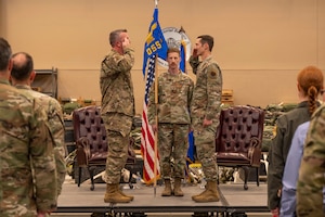U.S. Air Force Lt. Col. Patrick Chapman, 355th Operations Group deputy commander, left, salutes Lt. Col. Aaron Knight, former 355th Operations Support Squadron commander, right, during the 355th OSS inactivation ceremony at Davis-Monthan Air Force Base, Arizona, April 3, 2025. The 355th OSS directed operational support functions including airfield management, air traffic control, weather services, weapons and tactics, plans and exercises, and intelligence for the 355th Operations Group.