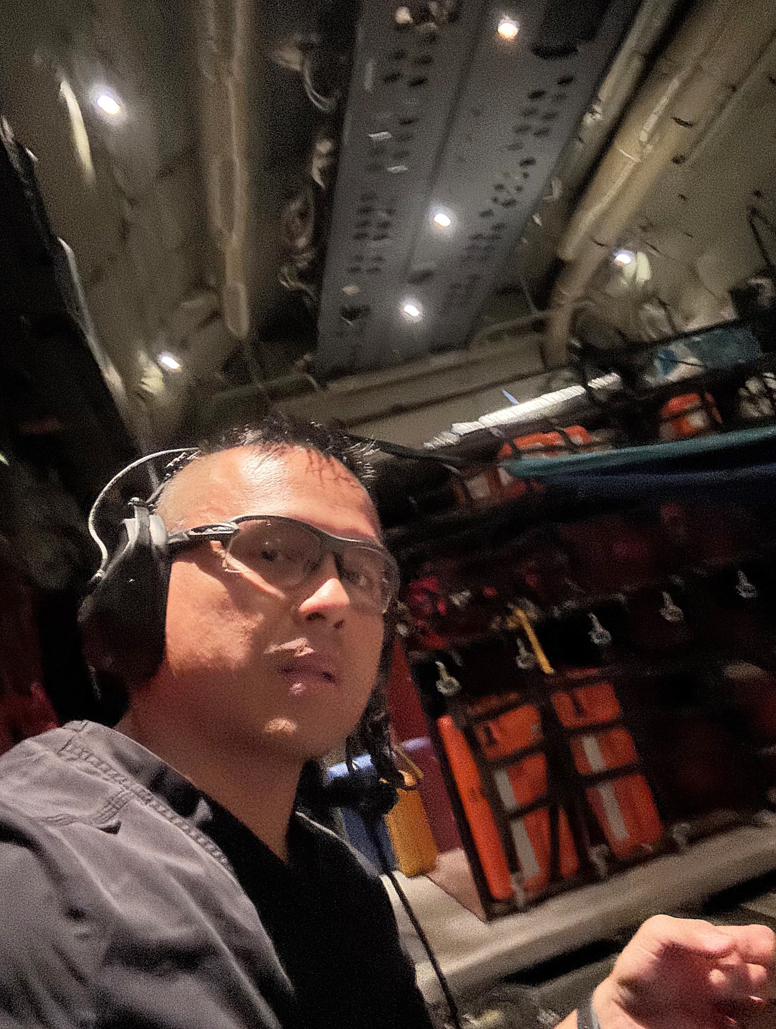 Capt. Jason Pureza, a member of the 624th Aeromedical Staging Squadron, Critical Care Air Transport Team, while in his civilian capacity, responds to a medical emergency while on a HC-130J on Nov.16, 2024.