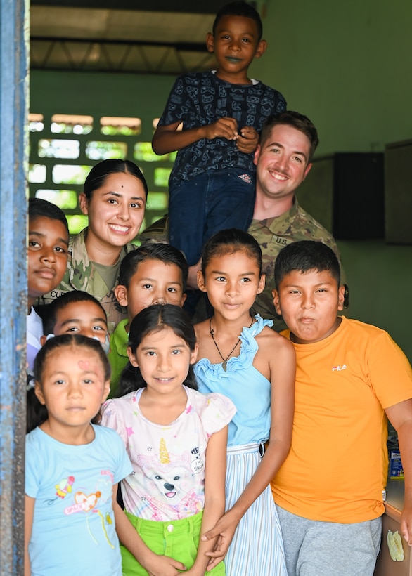 Members of Joint Task Force-Bravo Medical Detachment pose for a photo with children from Sardinilla during PANAMAX-Alpha Phase 0 in Panama, March 27, 2025.
