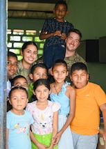 Members of Joint Task Force-Bravo Medical Detachment pose for a photo with children from Sardinilla during PANAMAX-Alpha Phase 0 in Panama, March 27, 2025.
