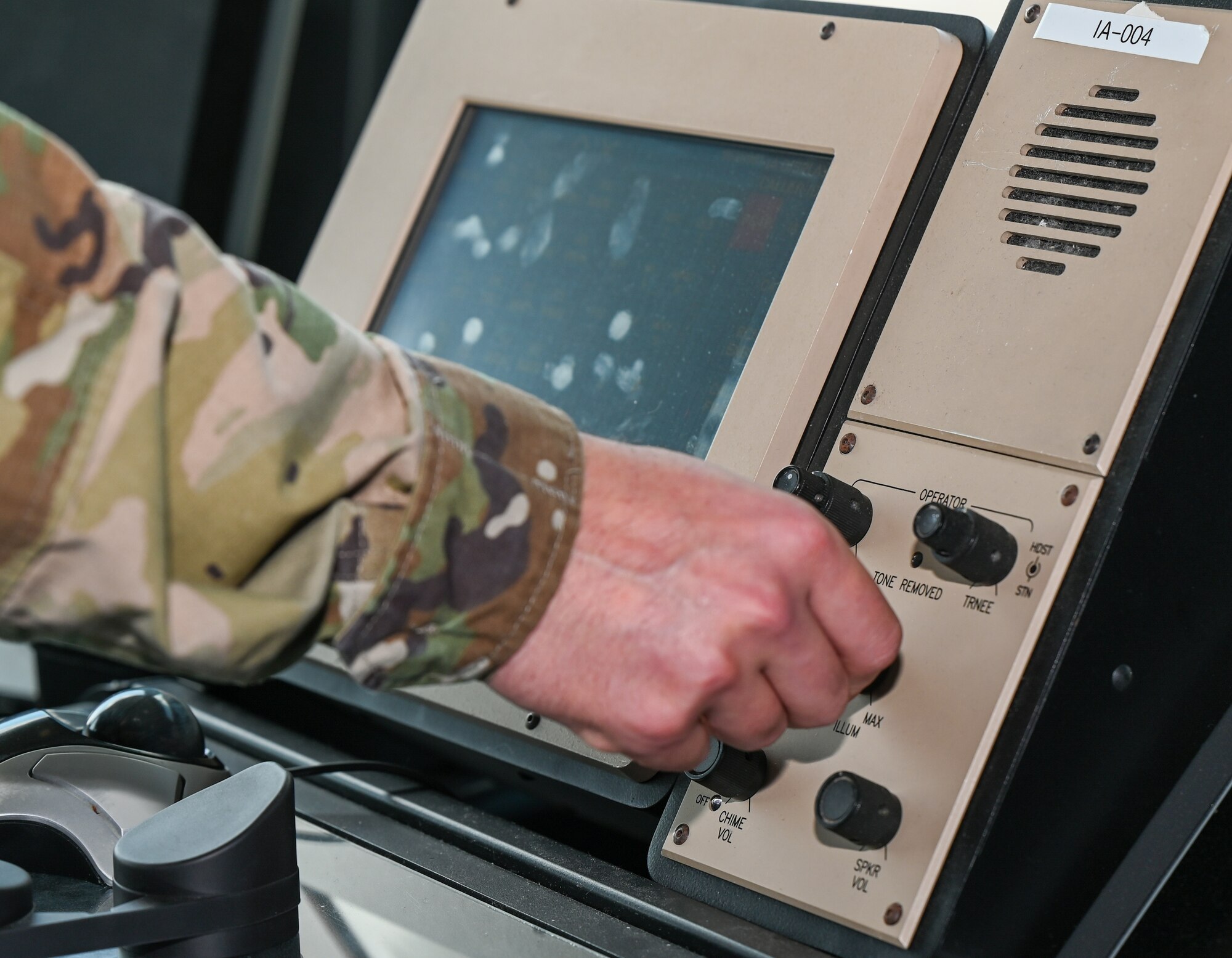 U.S. Air Force Senior Airman Logan Jarrett, 42nd Operations Support Squadron air traffic controller, turns a nob on an enhanced terminal voice switch at Maxwell Air Force Base, Alabama, April 1, 2025.
