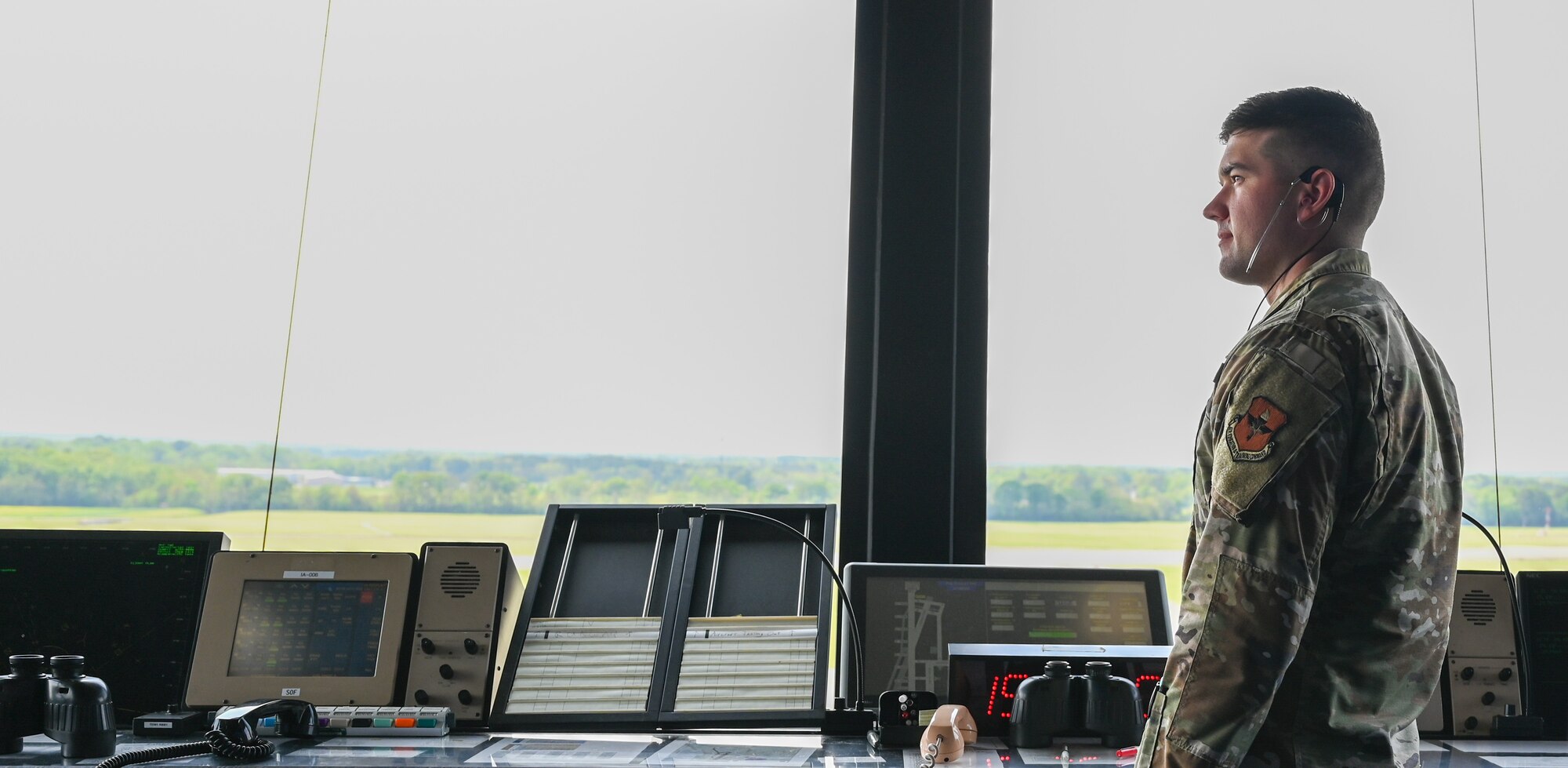 U.S. Air Force Senior Airman Logan Jarrett, 42nd Operations Support Squadron air traffic controller, looks toward the airfield at Maxwell Air Force Base, Alabama, April 1, 2025.