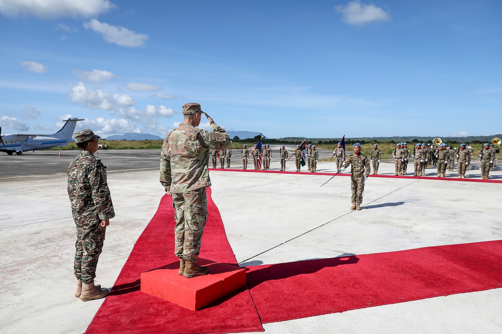 Air Force Gen. Steve Nordhaus, chief, National Guard Bureau, joins Maj. Gen. Calisto dos Santos Coliati, Timor-Leste’s vice chief of defense and Air Force Brig. Gen. Thomas Hannon, assistant adjutant general, Rhode Island Air National Guard, in a ribbon-cutting ceremony to mark the handover of a humanitarian aid and disaster relief warehouse, and an aircraft hangar, Baucau, Timor-Leste, April 4, 2025.