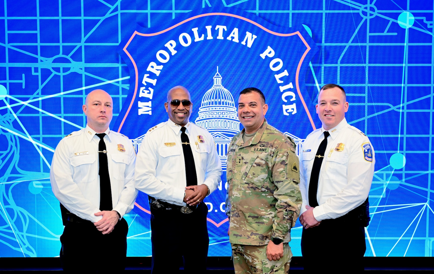 Members of the DC National Guard Counterdrug Program, D.C. Army National Guard Aviation Command, and other sections participate in a strategic briefing at Metropolitan Police Department Headquarters, in Washington, DC, on March 25, 2025. They discussed the impacts and evolution of the Counterdrug Program, focusing on strengthening partnerships and enhancing community-based drug prevention initiatives.