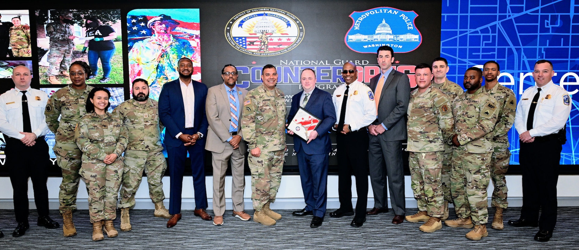 Members of the DC National Guard Counterdrug Program, D.C. Army National Guard Aviation Command, and other sections participate in a strategic briefing at Metropolitan Police Department Headquarters, in Washington, DC, on March 25, 2025. They discussed the impacts and evolution of the Counterdrug Program, focusing on strengthening partnerships and enhancing community-based drug prevention initiatives.