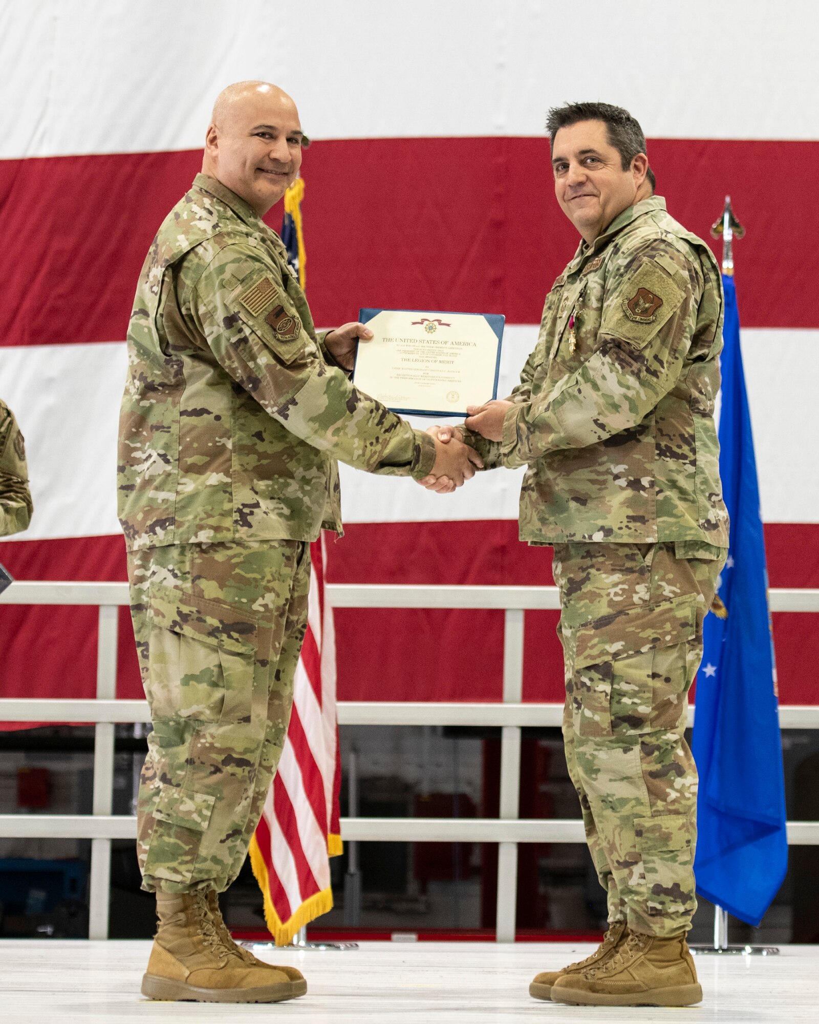 Chief Master Sgt. Christian Biancur, 932nd Airlift Wing, outgoing command chief, was awarded the Legion of Merit medal by Col. Jeffrey Smith, 932nd AW commander, during the Change of Responsibility ceremony at Scott Air Force Base, Illinois, April 5, 2025. (U.S. Air Force photo by Staff Sgt. Brooke Spenner)