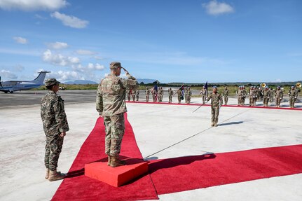 Air Force Gen. Steve Nordhaus, chief, National Guard Bureau, joins Maj. Gen. Calisto dos Santos Coliati, Timor-Leste’s vice chief of defense and Air Force Brig. Gen. Thomas Hannon, assistant adjutant general, Rhode Island Air National Guard, in a ribbon-cutting ceremony to mark the handover of a humanitarian aid and disaster relief warehouse, and an aircraft hangar, Baucau, Timor-Leste, April 4, 2025.