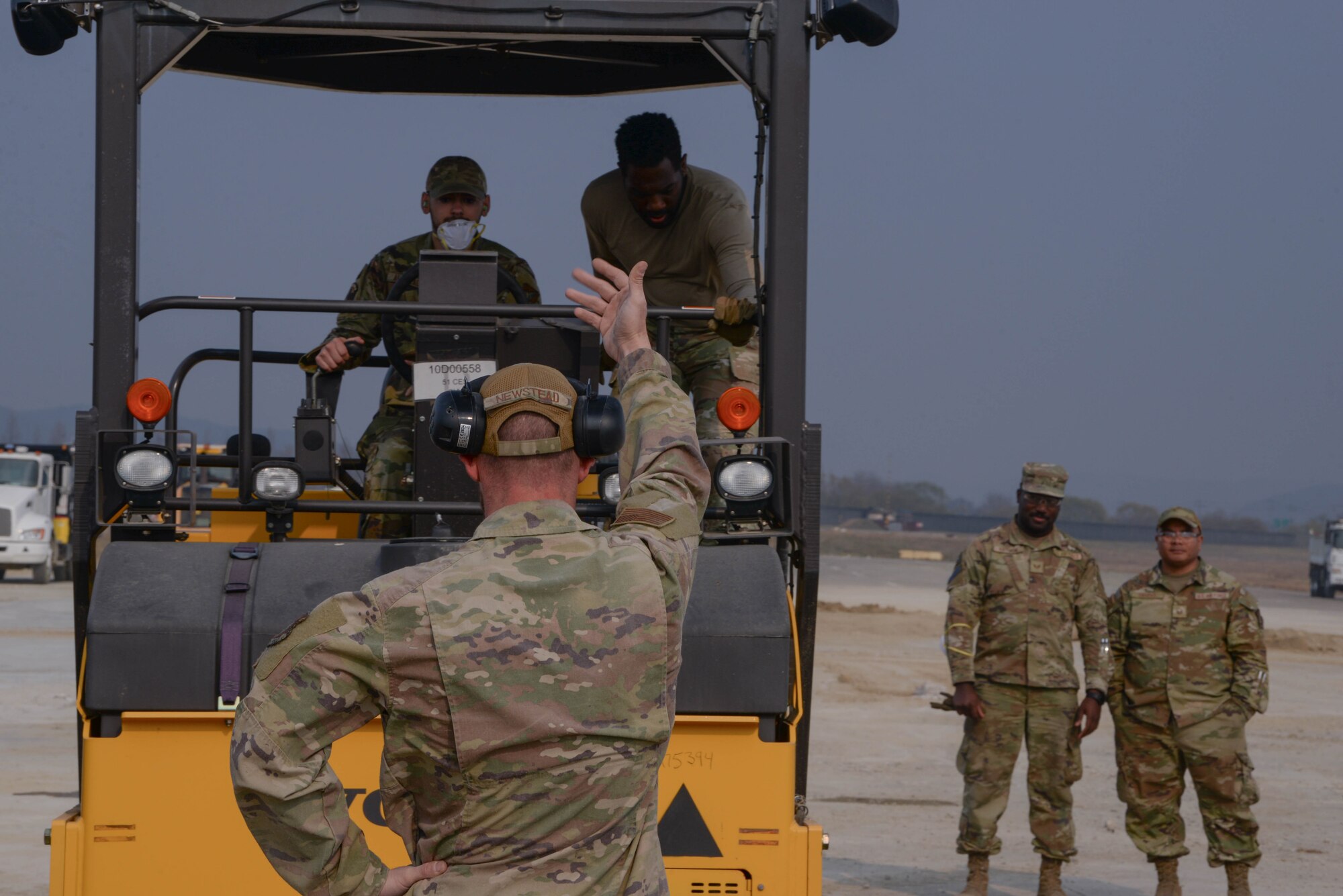 U.S. Air Force Airmen assigned to the 51st Civil Engineer Squadron, roll and flatten freshly poured asphalt to repair a simulated crater at Osan Air Base, Republic of Korea, April 3, 2025. The efforts were part of a day-long instructional and hands-on rapid airfield damage repair training to educate and prepare participants for the upcoming joint and combined IRON RADR exercise hosted by the 51st CES. (U.S. Air Force photo by Staff Sgt. Kahdija Slaughter)