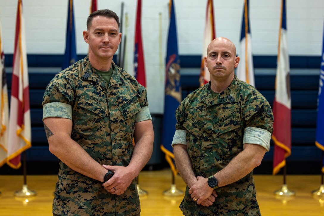U.S. Marine Corps Sgt. Maj. Levi A. Gates, left, the oncoming sergeant major of 2d Intelligence Battalion, II Marine Expeditionary Force Information Group, and Sgt. Maj. Mark J. Miller Jr., the off going sergeant major, pose for a photo following a relief and appointment ceremony at Marine Corps Base Camp Lejeune, North Carolina, April 3, 2025. The relief and appointment signifies the passing of authority from the off going sergeant major to the oncoming sergeant major. (U.S. Marine Corps photo by Lance Cpl. John Allen)