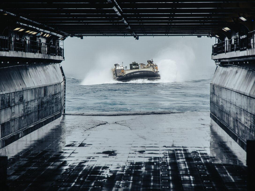 Marines with the 22nd Marine Expeditionary Unit (MEU) arrive on a landing craft air cushion (LCAC) assigned to the Wasp-class amphibious assault ship USS Iwo Jima (LHD 7), of Iwo Jima Amphibious Readiness Group (ARG), in support of Amphibious Squadron 8 (PHIBRON 8), 22nd MEU Integration (PMINT) while underway in the Atlantic Ocean April 3, 2025. PMINT is the 22nd MEU’s first opportunity in their pre-deployment training program to fully integrate with PHIBRON 8 while at sea, allowing Marines and Sailors to train together as an ARG/MEU team. (U.S. Marine Corps photo by Sgt. Tanner Bernat)