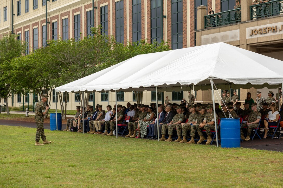 Brig. Gen. John K. Jarrard addresses the audience during 4th Marine Division's Relief and Appointment of Sgt. Maj. Christopher J. Adams and welcoming of Sgt. Maj. Garett G. Kirkby, Marine Corps Support Facility New Orleans, Louisiana, Apr 4, 2025. The Relief and Appointment signifies the passing of authority from the outgoing Sergeant Major to the oncoming Sergeant Major. (U.S. Marine Corps photo by Sgt. Ethan A. Green)