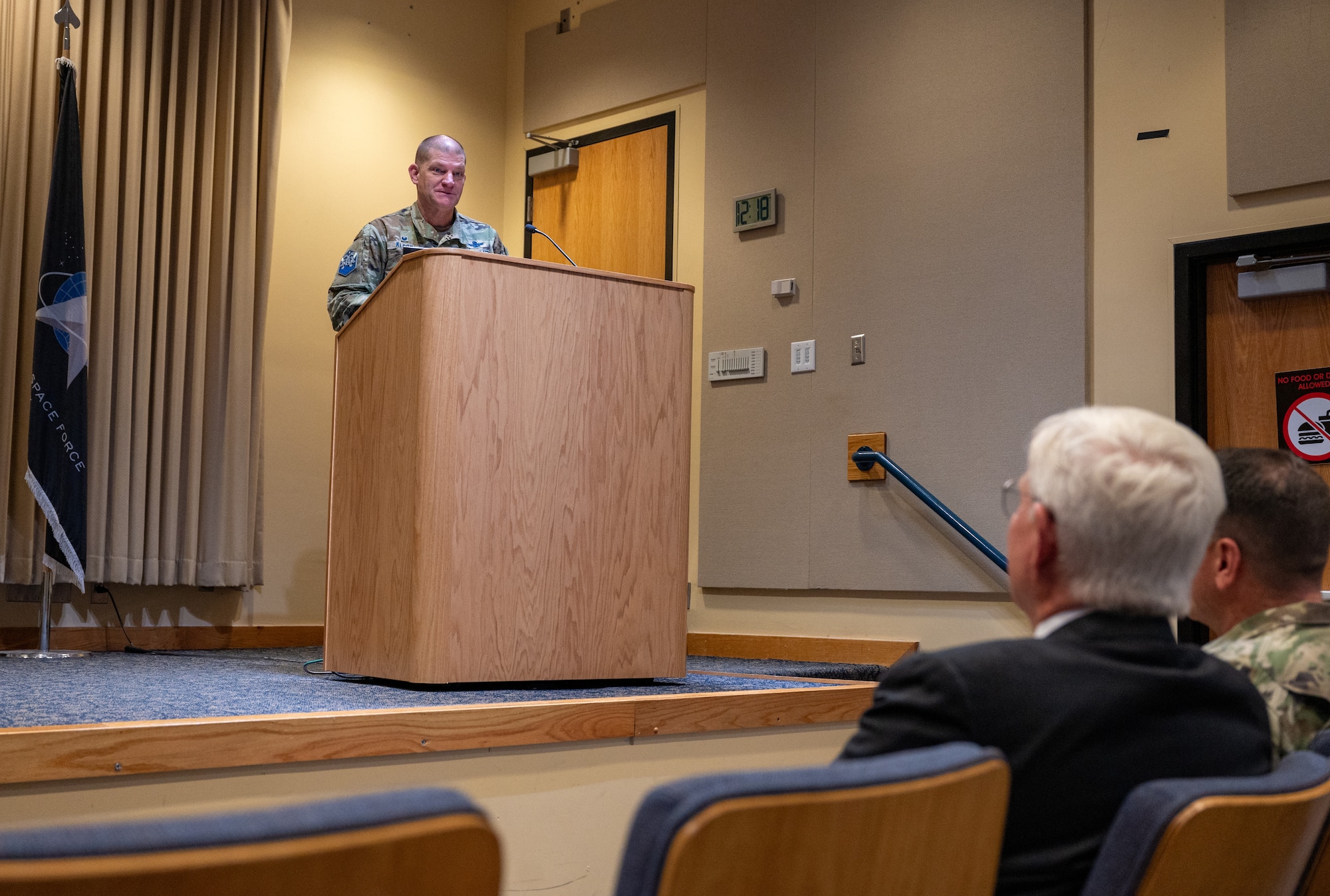 Col. Klock speaking at a podium