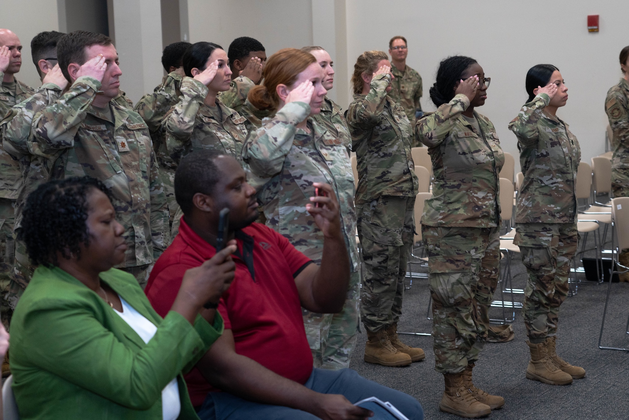 Airmen salute during the change of command ceremony.
