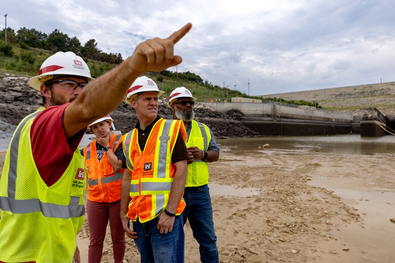 Construction site in partially filled dam spillway